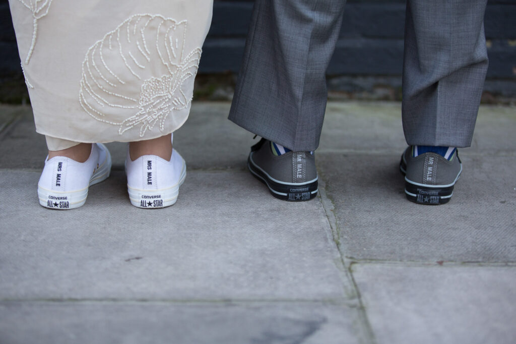 bride and groom with celebratory shoes